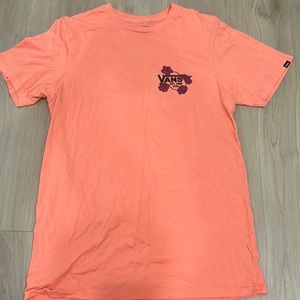 Brand is Vans, the color is a Pink/orange & black writing, the size is a small.
